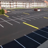 Striping and Parking Bumpers - B&T Seal Coating and Asphalt